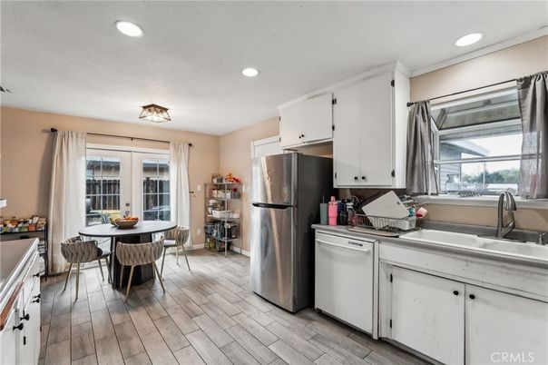 Dining room, Interior, Kitchen, Recessed Lighting, Stainless Steel Appliances, Wood Texture Flooring