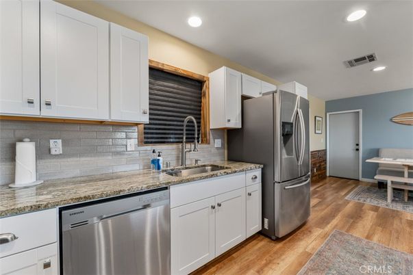 Dining room, Interior, Kitchen, Recessed Lighting, Stainless Steel Appliances, Wood Texture Flooring