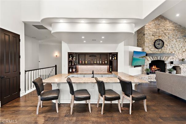 Fireplace, Interior, Living room, Recessed Lighting, Stone Walls, Wood Texture Flooring