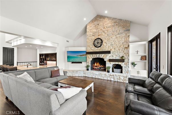 Fireplace, Interior, Living room, Recessed Lighting, Stone Walls, Wood Texture Flooring