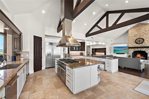 Fireplace, Interior, Kitchen, Living room, Recessed Lighting, Stainless Steel Appliances, Stone Walls, Wooden Beams