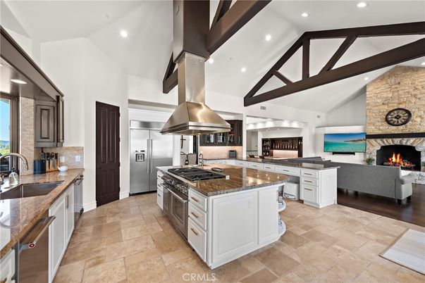 Fireplace, Interior, Kitchen, Living room, Recessed Lighting, Stainless Steel Appliances, Stone Walls, Wooden Beams