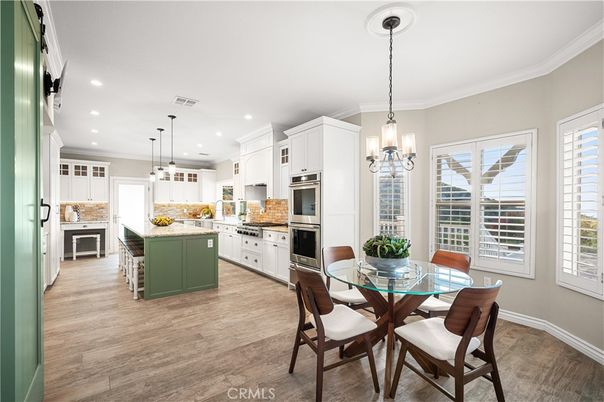 Dining room, Interior, Kitchen, Pendant Lights, Recessed Lighting, Stainless Steel Appliances, Wood Texture Flooring