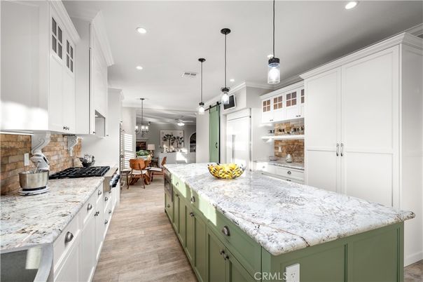 Chandelier, Dining room, Interior, Kitchen, Pendant Lights, Recessed Lighting, Stainless Steel Appliances, Wood Texture Flooring