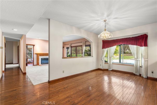 Chandelier, Empty room, Fireplace, Interior, Recessed Lighting, Wood Texture Flooring