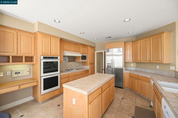 Interior, Kitchen, Recessed Lighting, Stainless Steel Appliances, Tile Countertops