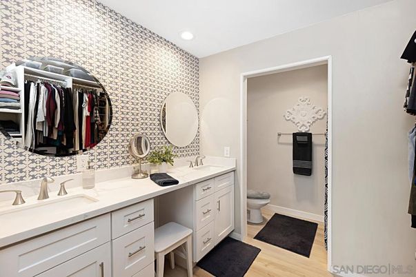 Bathroom, Dual Sink Vanities, Interior, Recessed Lighting, Walk-in Closets, Wood Texture Flooring