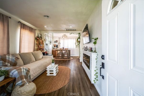Dining room, Fireplace, Interior, Living room, Recessed Lighting, Wood Texture Flooring