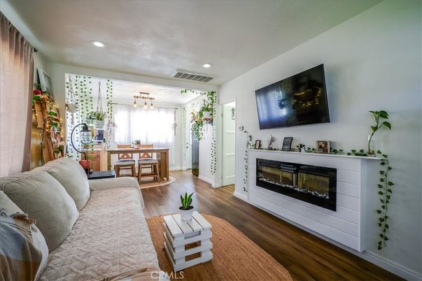 Dining room, Fireplace, Interior, Living room, Pendant Lights, Recessed Lighting, Wood Texture Flooring