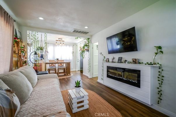 Dining room, Fireplace, Interior, Living room, Pendant Lights, Recessed Lighting, Wood Texture Flooring
