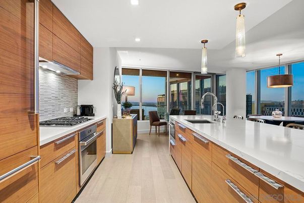 Dining room, Interior, Kitchen, Living room, Pendant Lights, Recessed Lighting, Stainless Steel Appliances, Water, Wood Texture Flooring
