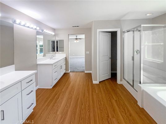 Bathroom, Dual Sink Vanities, Glass Shower, Interior, Recessed Lighting, Wood Texture Flooring