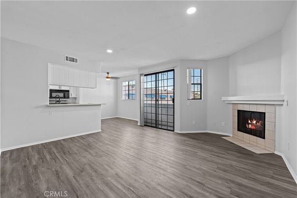 Empty room, Fireplace, Interior, Kitchen, Recessed Lighting, Wood Texture Flooring