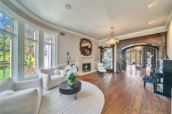 Chandelier, Fireplace, Interior, Living room, Piano, Recessed Lighting, Wood Texture Flooring