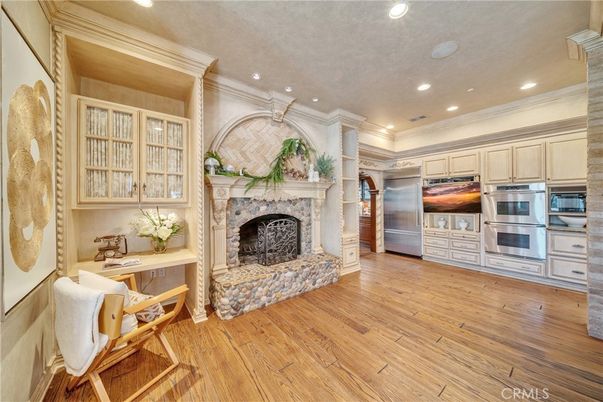 Fireplace, Interior, Kitchen, Recessed Lighting, Stainless Steel Appliances, Wood Texture Flooring