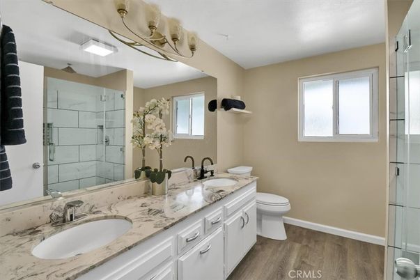 Bathroom, Dual Sink Vanities, Glass Shower, Interior, Wood Texture Flooring