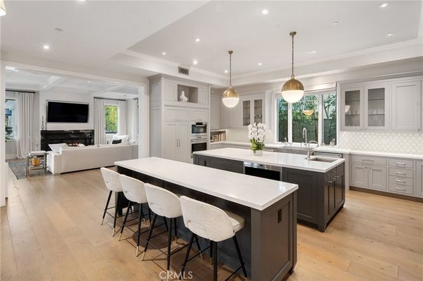 Fireplace, Interior, Kitchen, Living room, Pendant Lights, Recessed Lighting, Stainless Steel Appliances, Wood Texture Flooring