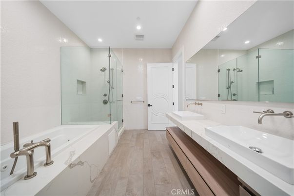 Bathroom, Dual Sink Vanities, Glass Shower, Interior, Recessed Lighting, Wood Texture Flooring