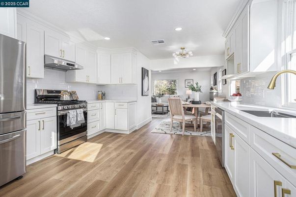 Dining room, Interior, Kitchen, Recessed Lighting, Stainless Steel Appliances, Wood Texture Flooring