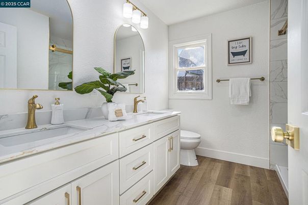 Bathroom, Dual Sink Vanities, Interior, Marble Walls, Wood Texture Flooring