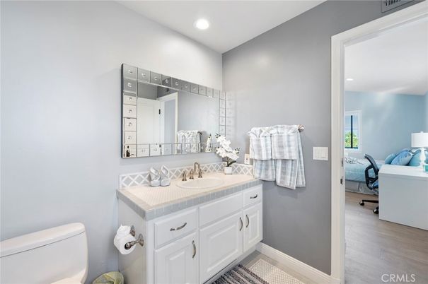 Bathroom, Interior, Recessed Lighting, Tile Countertops, Wood Texture Flooring