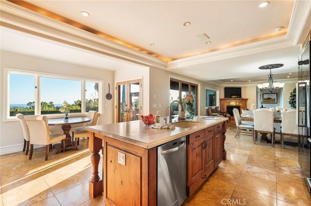 Chandelier, Dining room, Fireplace, Interior, Kitchen, Recessed Lighting, Stainless Steel Appliances