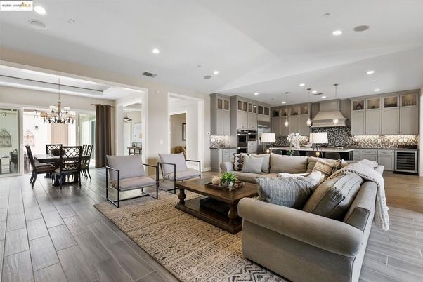 Chandelier, Dining room, Interior, Kitchen, Living room, Pendant Lights, Recessed Lighting, Stainless Steel Appliances, Wood Texture Flooring