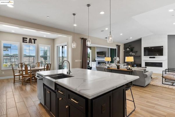 Dining room, Fireplace, Interior, Kitchen, Living room, Pendant Lights, Recessed Lighting, Stainless Steel Appliances, Wood Texture Flooring