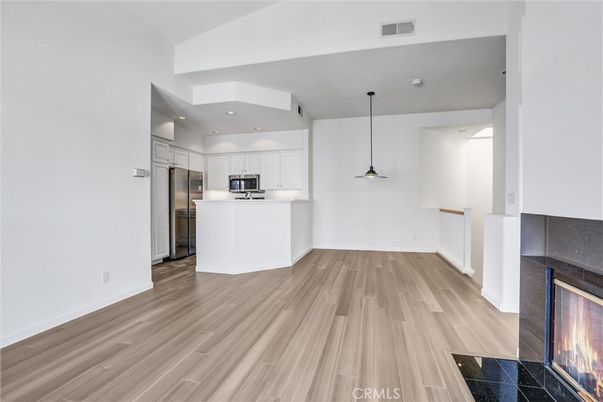 Fireplace, Interior, Kitchen, Pendant Lights, Recessed Lighting, Stainless Steel Appliances, Wood Texture Flooring