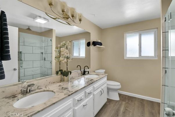 Bathroom, Dual Sink Vanities, Glass Shower, Interior, Wood Texture Flooring