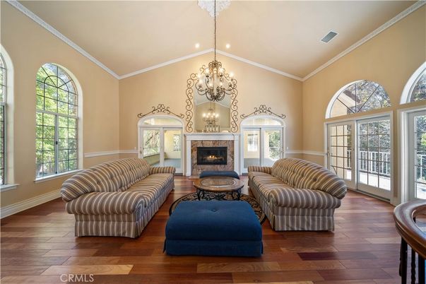 Chandelier, Fireplace, Interior, Living room, Recessed Lighting, Wood Texture Flooring