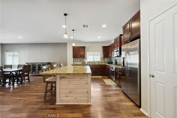 Dining room, Interior, Kitchen, Pendant Lights, Recessed Lighting, Stainless Steel Appliances, Wood Texture Flooring