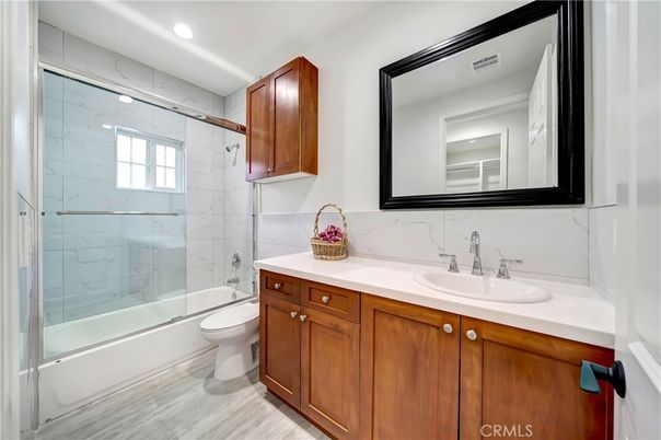 Bathroom, Glass Shower, Interior, Marble Walls, Recessed Lighting, Wood Texture Flooring
