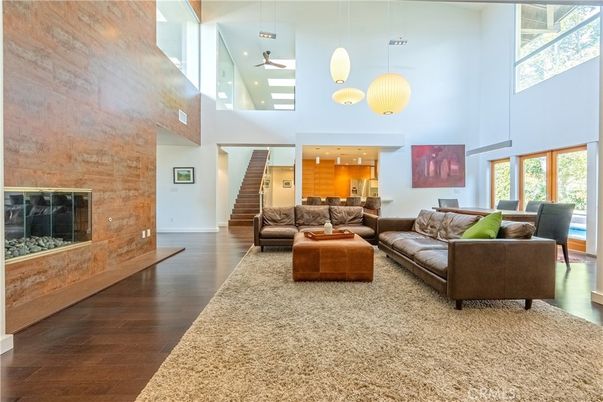 Fireplace, Interior, Living room, Pendant Lights, Recessed Lighting, Stone Walls, Wood Texture Flooring