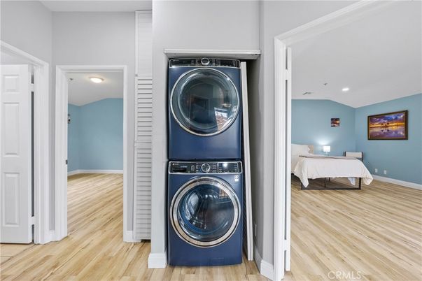 Bedroom, Interior, Recessed Lighting, Utility Closets, Washer, Wood Texture Flooring