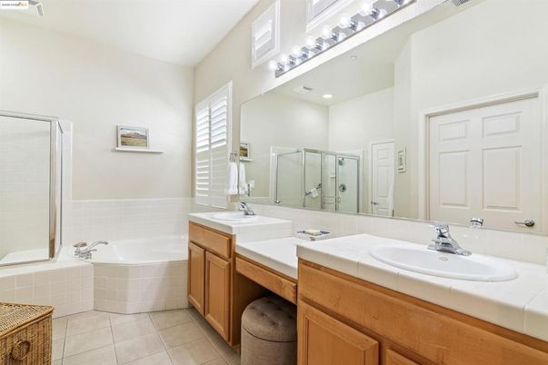 Bathroom, Dual Sink Vanities, Interior, Recessed Lighting, Tile Countertops
