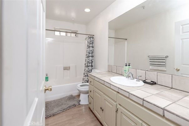 Bathroom, Interior, Recessed Lighting, Tile Countertops, Wood Texture Flooring