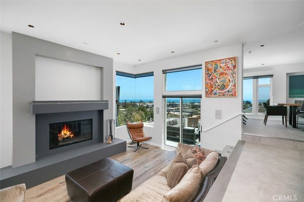 Dining room, Fireplace, Interior, Living room, Recessed Lighting, Water, Wood Texture Flooring