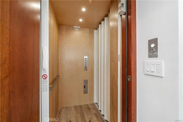 Elevator, Interior, Recessed Lighting, Wood Texture Flooring, Wooden Walls