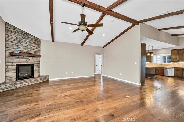 Empty room, Fireplace, Interior, Kitchen, Pendant Lights, Recessed Lighting, Stone Walls, Wooden Beams, Wood Texture Flooring