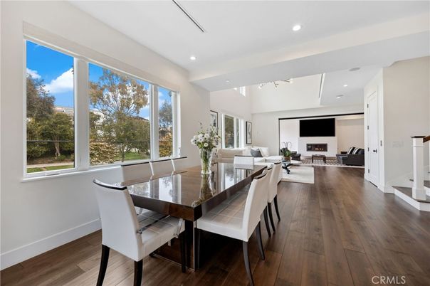 Dining room, Fireplace, Interior, Living room, Recessed Lighting, Wood Texture Flooring