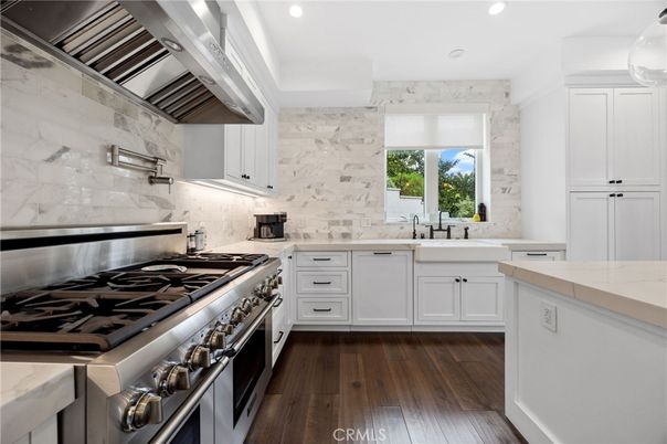 Interior, Kitchen, Marble Walls, Recessed Lighting, Stainless Steel Appliances, Wood Texture Flooring