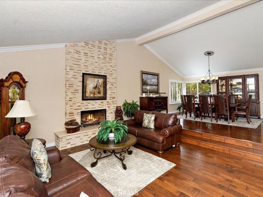 Chandelier, Dining room, Fireplace, Interior, Living room, Stone Walls, Wood Texture Flooring
