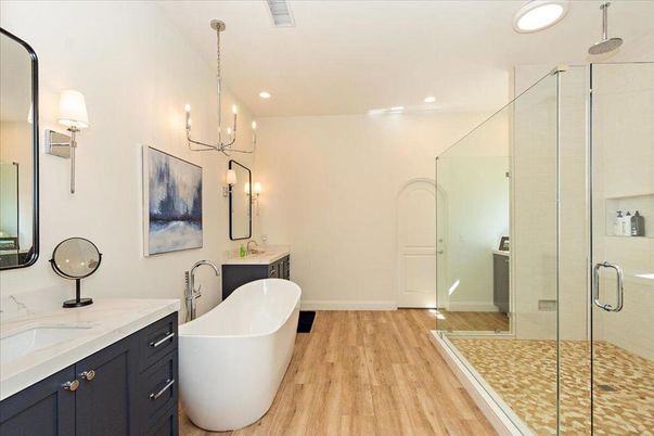 Bathroom, Chandelier, Dual Sink Vanities, Free Standing Baths, Glass Shower, Interior, Recessed Lighting, Wood Texture Flooring