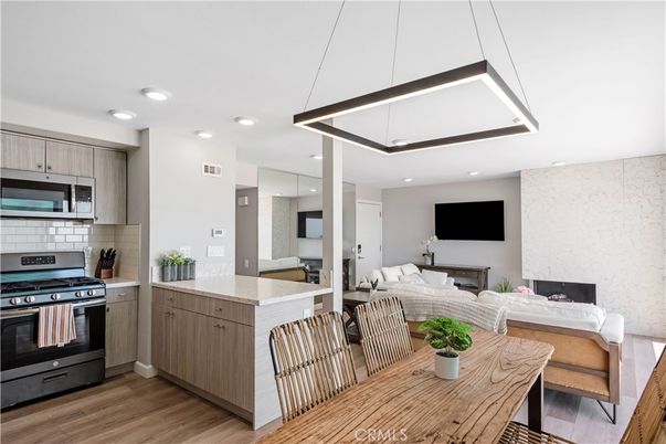 Dining room, Interior, Kitchen, Living room, Recessed Lighting, Stainless Steel Appliances, Wood Texture Flooring