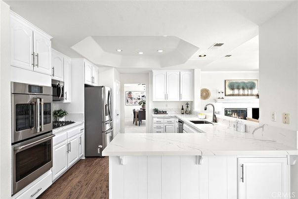 Fireplace, Interior, Kitchen, Recessed Lighting, Stainless Steel Appliances, Wood Texture Flooring