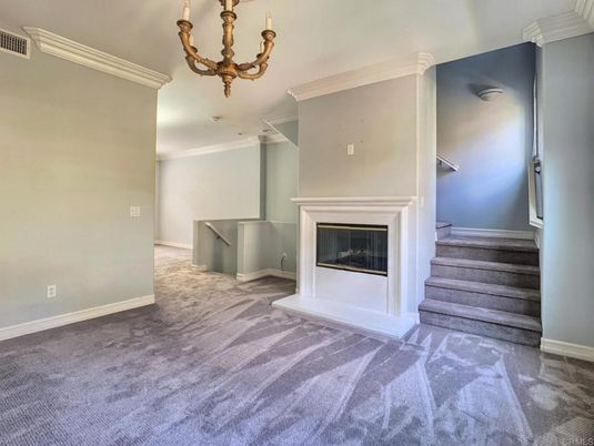 Chandelier, Empty room, Fireplace, Interior