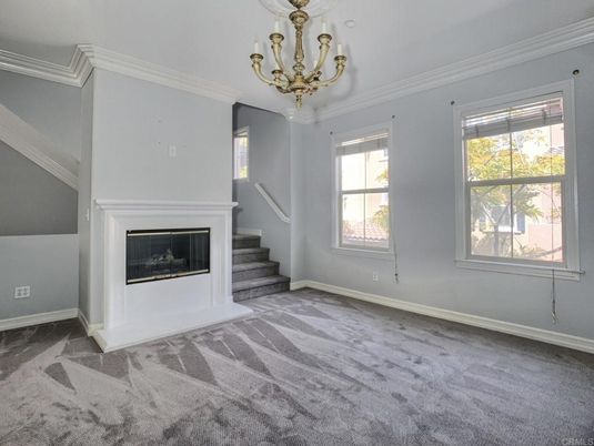 Chandelier, Empty room, Fireplace, Interior
