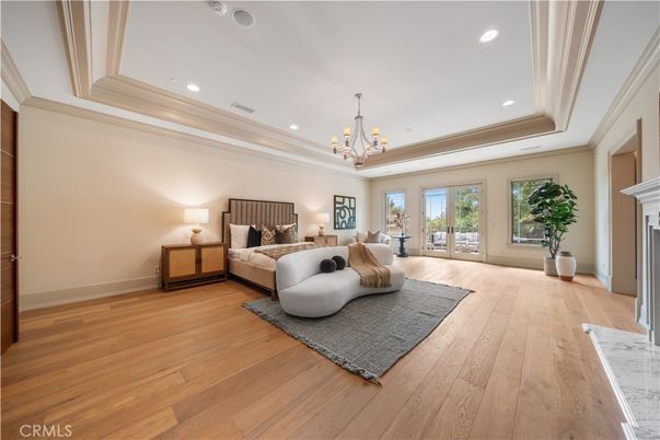 Bedroom, Chandelier, Fireplace, Interior, Recessed Lighting, Wood Texture Flooring