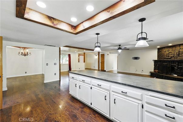 Empty room, Fireplace, Interior, Pendant Lights, Recessed Lighting, Stone Walls, Wood Texture Flooring